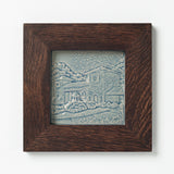 Decorative ceramic tile in blue glaze of Cincinnati Coney Island in Walnut Frame