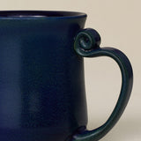 Close-up details of hand-thrown mug by Rookwood