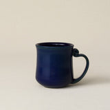 Hand-thrown ceramic mug by Rookwood Pottery