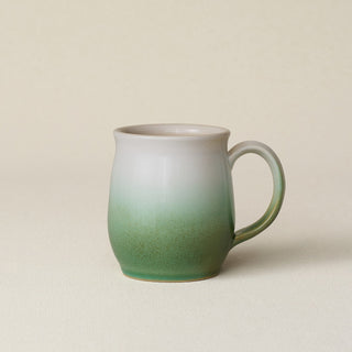 Hand-thrown ceramic mug by Rookwood Pottery