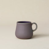 Hand-thrown ceramic mug by Rookwood Pottery