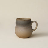 Hand-thrown ceramic mug by Rookwood Pottery