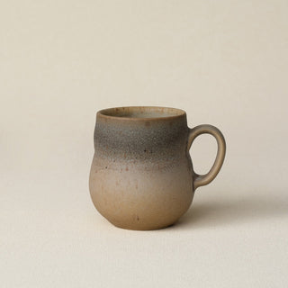 Hand-thrown ceramic mug by Rookwood Pottery