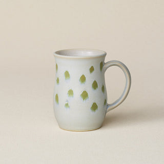 Hand-thrown ceramic mug by Rookwood Pottery