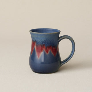 Hand-thrown ceramic mug by Rookwood Pottery