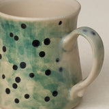 Close-up details of hand-thrown mug by Rookwood