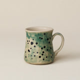 Hand-thrown ceramic mug by Rookwood Pottery