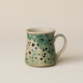 Hand-thrown ceramic mug by Rookwood Pottery