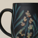 Close-up details of hand-thrown mug by Rookwood