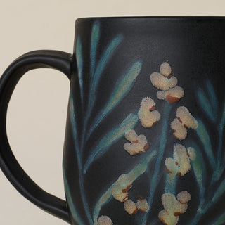 Close-up details of hand-thrown mug by Rookwood