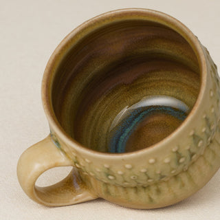 Close-up details of hand-thrown mug by Rookwood
