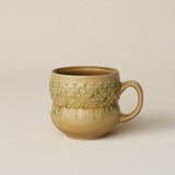 Hand-thrown ceramic mug by Rookwood Pottery