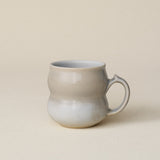 Hand-thrown ceramic mug by Rookwood Pottery