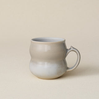 Hand-thrown ceramic mug by Rookwood Pottery
