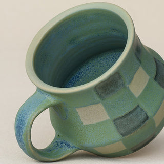 Close-up details of hand-thrown mug by Rookwood