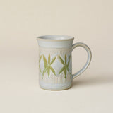Hand-thrown ceramic mug by Rookwood Pottery