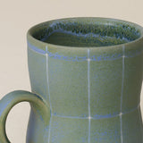 Close-up details of hand-thrown mug by Rookwood