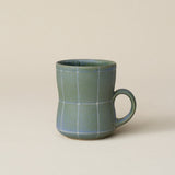Hand-thrown ceramic mug by Rookwood Pottery