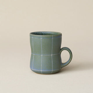 Hand-thrown ceramic mug by Rookwood Pottery