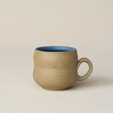 Hand-thrown ceramic mug by Rookwood Pottery