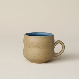 Hand-thrown ceramic mug by Rookwood Pottery