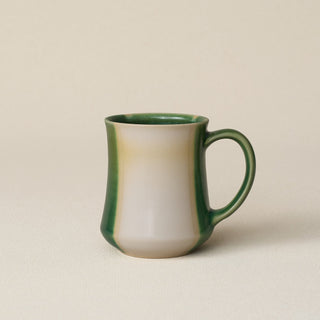 Hand-thrown ceramic mug by Rookwood Pottery