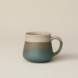 Hand-thrown ceramic mug by Rookwood Pottery