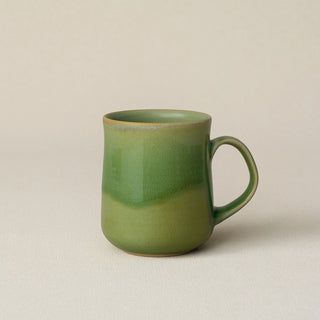 Hand-thrown ceramic mug by Rookwood Pottery