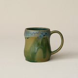Hand-thrown ceramic mug by Rookwood Pottery