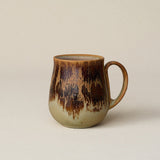Hand-thrown ceramic mug by Rookwood Pottery