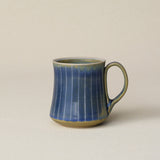 Hand-thrown ceramic mug by Rookwood Pottery
