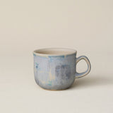 Hand-thrown ceramic mug by Rookwood Pottery