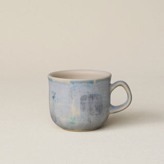 Hand-thrown ceramic mug by Rookwood Pottery
