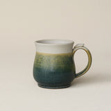 Hand-thrown ceramic mug by Rookwood Pottery