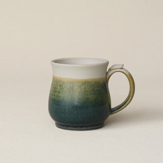 Hand-thrown ceramic mug by Rookwood Pottery
