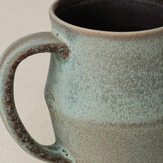 Close-up details of hand-thrown mug by Rookwood
