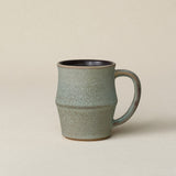 Hand-thrown ceramic mug by Rookwood Pottery
