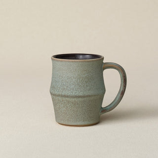 Hand-thrown ceramic mug by Rookwood Pottery
