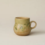 Hand-thrown ceramic mug by Rookwood Pottery