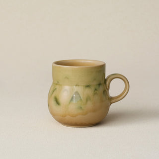 Hand-thrown ceramic mug by Rookwood Pottery
