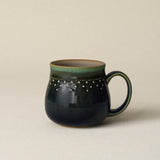 Hand-thrown ceramic mug by Rookwood Pottery