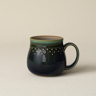 Hand-thrown ceramic mug by Rookwood Pottery