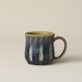 Hand-thrown ceramic mug by Rookwood Pottery