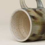 Close-up details of hand-thrown mug by Rookwood