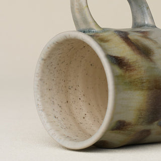 Close-up details of hand-thrown mug by Rookwood