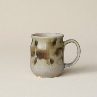 Hand-thrown ceramic mug by Rookwood Pottery