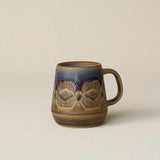 Hand-thrown ceramic mug by Rookwood Pottery