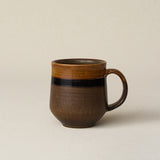 Hand-thrown ceramic mug by Rookwood Pottery