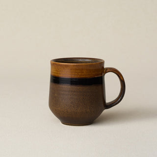Hand-thrown ceramic mug by Rookwood Pottery