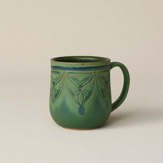 Hand-thrown ceramic mug by Rookwood Pottery